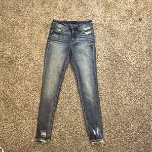 Buckle black skinny jeans